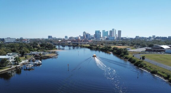 Aerial Drone Photography of downtown Tampa, Florida, and the water taxi on the Hillsborough river by Anita Denunzio.